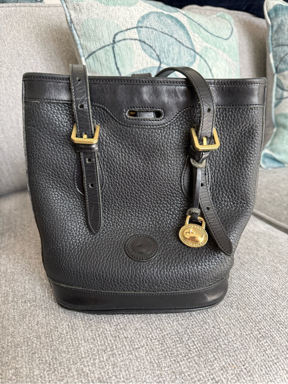 Dooney & Bourke Black Pebbled Leather Bucket Tote with Gold Accent